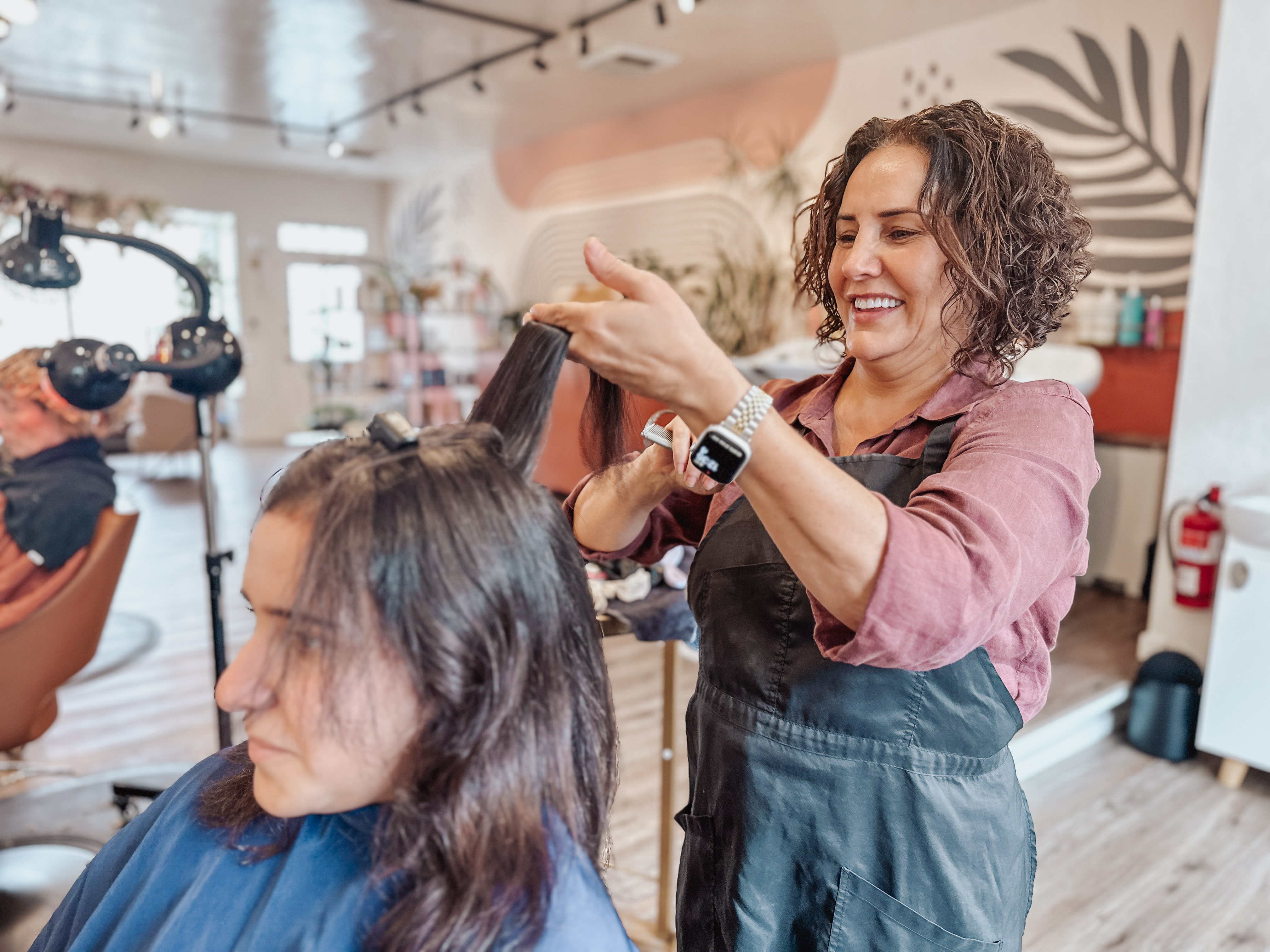Shakufeh at work styling hair